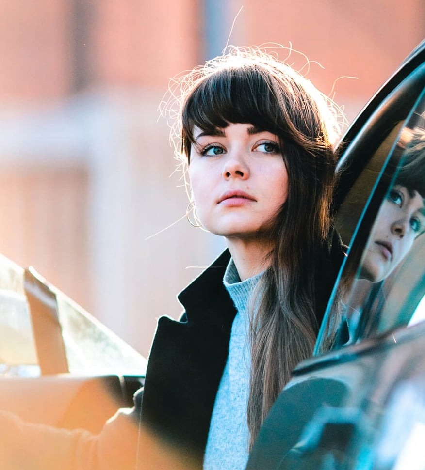 Girl getting out of a car