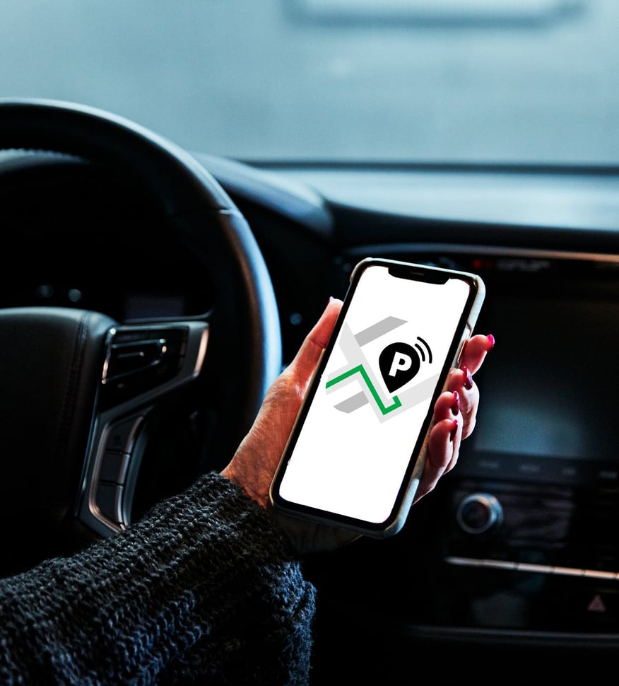 Hand holding phone with MobilPark app